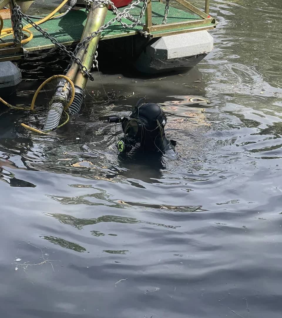 Utah Water Gardens professional diver in full diving gear ready for pond dredging service